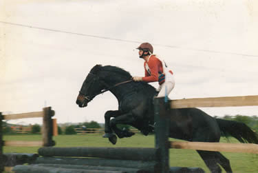 Ebony attacking the first fence at a hunter trial with her usual gusto.