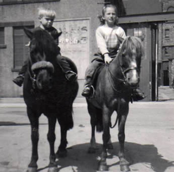 Sue with her brother about to ride on the beaches at Redcar, North Yorkshire, late 1950s