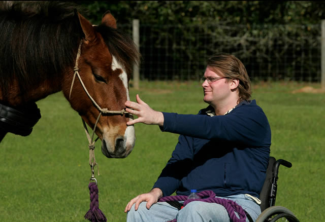 In a March 10, 2011 photo, Ritt Chitwood spends some time with his new horse, Top Notch. The horse is a gift from veterinarian Dr. Cindy Brasfield. (AP Photo/Press-Register, Victor Calhoun) 
